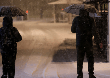 Blizzard sparks heaviest snow in a DECADE as hurricane-force winds leave thousands without power and rare 'thundersnow' phenomenon strikes