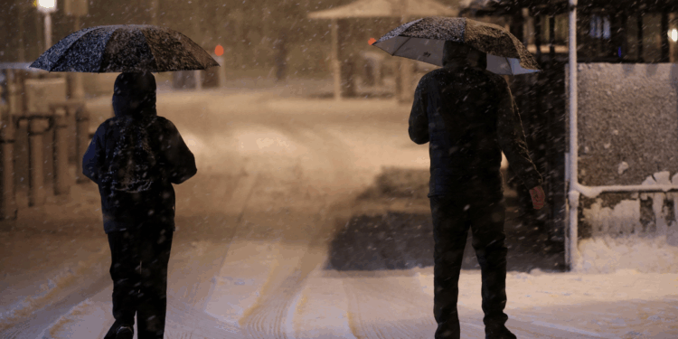 Blizzard sparks heaviest snow in a DECADE as hurricane-force winds leave thousands without power and rare 'thundersnow' phenomenon strikes