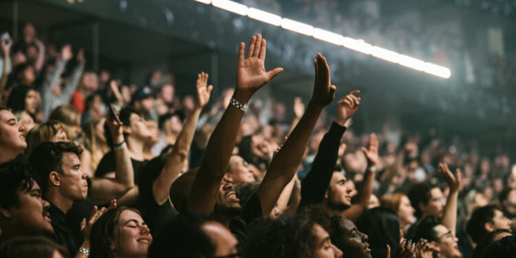 John Piper on whether raising hands in worship is 'showing off'
