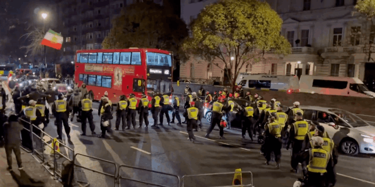 Iran democracy protesters clash with police outside London embassy as multiple arrests made