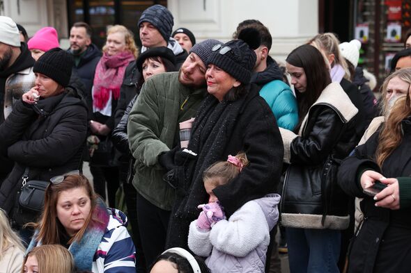 Dean's mother and brother watching while he sings