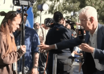 John McEnroe goes rogue as tennis commentator pulls woman onto set during Australian Open coverage