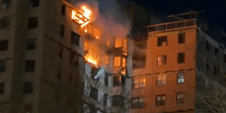 Emergency crews rush to huge blaze engulfing upper floors of high-rise