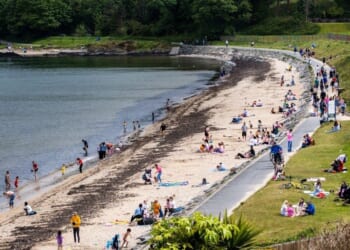 Woman in her 60s dies and two others injured after getting into trouble off popular UK beach