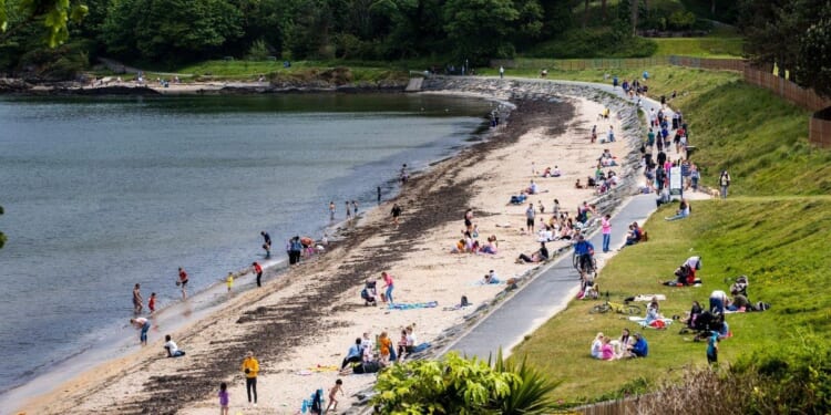 Woman in her 60s dies and two others injured after getting into trouble off popular UK beach