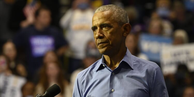 Barack Obama issues 'wake-up call' to Americans as he warns 'core values under assault' after 'heartbreaking' Minneapolis shooting