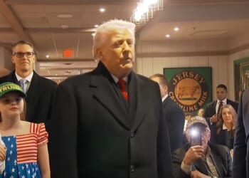 Trump prays with supporter during campaign stop in Iowa