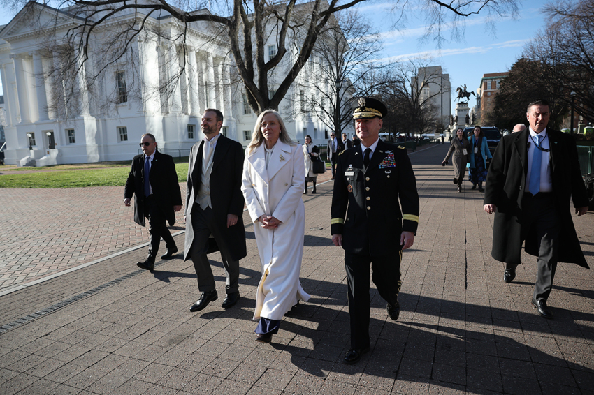 Virginia Governor Abigail Spanberger (C) walks to the Governor's Mansion with her husband, Adam Spanberger (2nd L), after she was sworn into office at the Virginia State Capitol on Jan. 17, 2026, in Richmond, Virginia. Spanberger is the first woman elected to the Commonwealth of Virginia’s highest office.