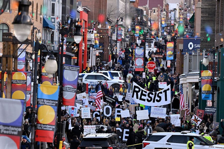 PARK CITY, UTAH - JANUARY 26: Demonstrators walk down Main Street protesting the United States Immigration and Customs Enforcement (ICE) during the 2026 Sundance Film Festival on January 26, 2026 in Park City, Utah. (Photo by David Becker/Getty Images)