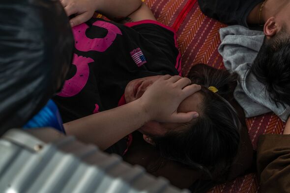 Indonesians freed from scam centres in Cambodia wait outside Ind Indonesians freed from scam centres in Cambodia wait outside Ind