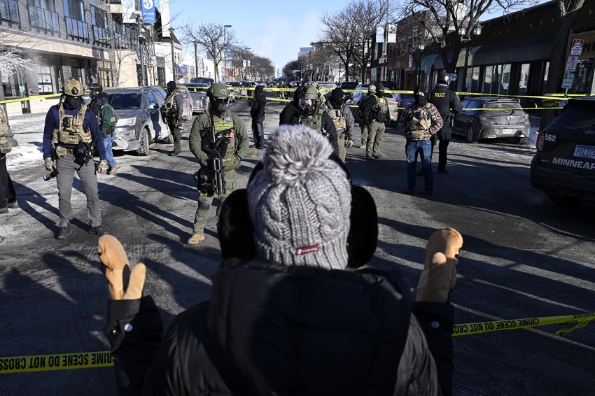 Federal agents block off the scene of a shooting as crowds gather on Jan. 24, 2026, in Minneapolis, Minnesota. Agents shot an armed protester who was attempting to thwart the arrest of a criminal illegal immigrant. The Trump administration has sent a reported 3,000 federal agents into the area, with more on the way, as they make a push to arrest criminal illegal immigrants in the region. 