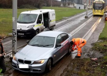 Manchester LIVE: City centre chaos after BMW gets stuck on tracks | UK | News