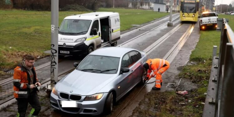 Manchester LIVE: City centre chaos after BMW gets stuck on tracks | UK | News