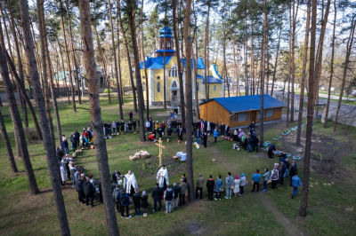 As seen from an aerial view, priests perform blessings while celebrating Orthodox Easter outside a war-damaged church on April 24, 2022 in Irpin, Ukraine. The towns around Kyiv are continuing a long road to what they hope is recovery, following weeks of brutal war as Russia made its failed bid to take Ukraine's capital. As Russia concentrates its attack on the east and south of the country, residents of the Kyiv region are returning to assess the war's toll on their communities. 