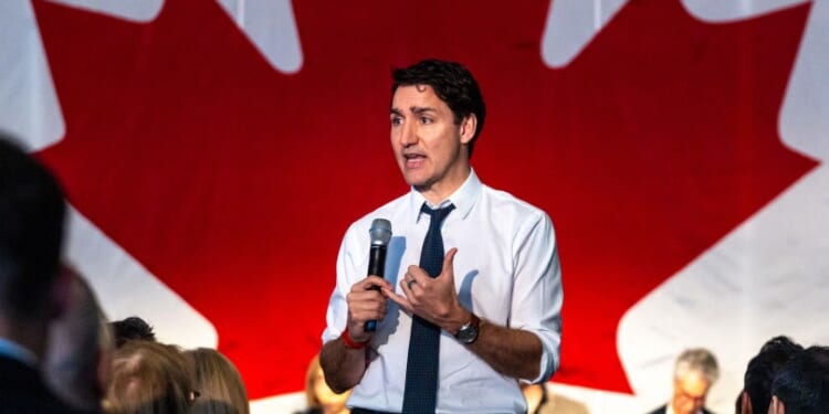 Trudeau appears to laugh after reporter tells him cameraman's mom died from COVID shot