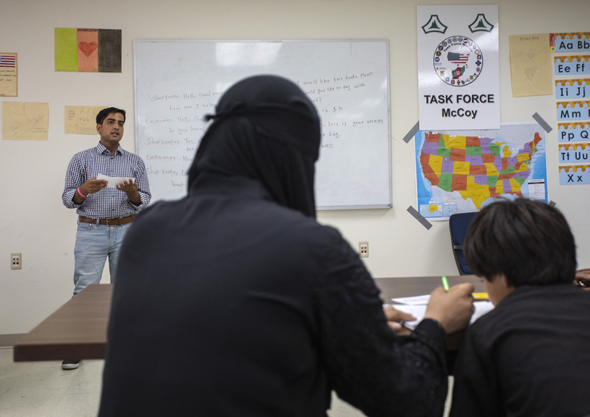 Afghan refugees take an educational class at Ft. McCoy U.S. Army base on Sept. 30, 2021, in Ft. McCoy, Wisconsin. There are approximately 12,600 Afghan refugees being cared for at the base under Operation Allies Welcome. 