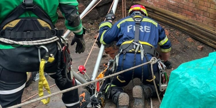 Man plunges 30ft down well on English high street as emergency crews race to rescue
