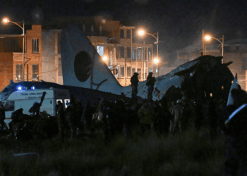 At least 15 dead after aircraft packed with banknotes crashes onto motorway