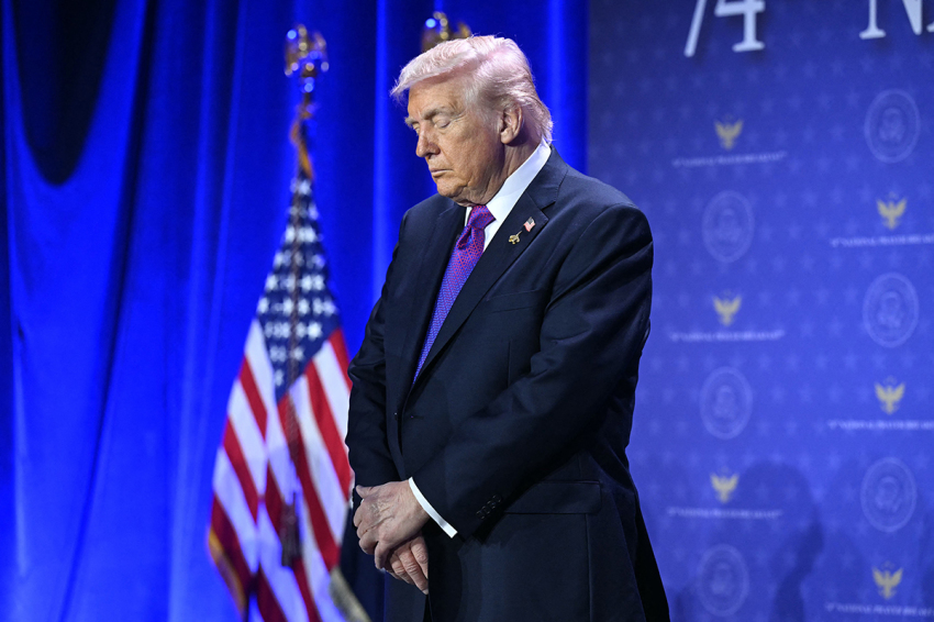 U.S. President Donald Trump bows his head in prayer during the National Prayer Breakfast at the Washington Hilton in Washington, D.C., on Feb. 5, 2026. 