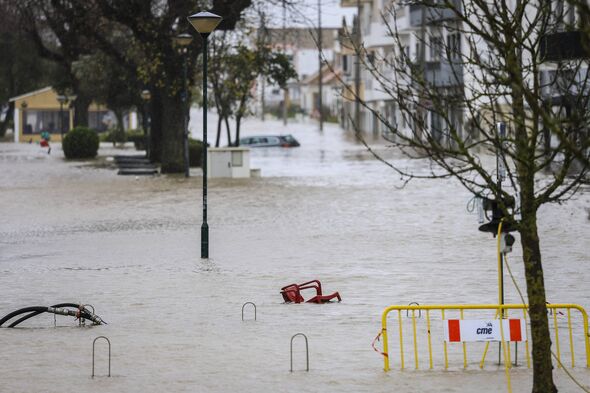 Chairs are pictured floating in a flooded street of Alcacer do Sal, south of Portugal, during Leonardo storm on February 4, 2026