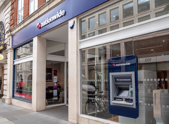 A branch of Nationwide Building Society in Cheapside in the City of London, with an ATM in the window.