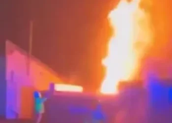 English football stadium set on fire in suspected arson attack as emergency services rush to the scene