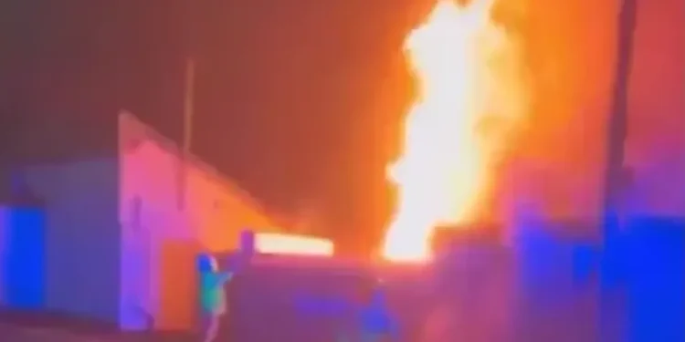 English football stadium set on fire in suspected arson attack as emergency services rush to the scene