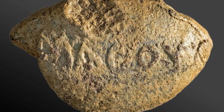 Researchers uncover 2,000-year-old bullet inscribed with ominous message