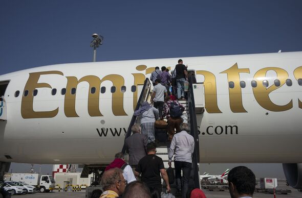 Passengers At The Dubai International Airport