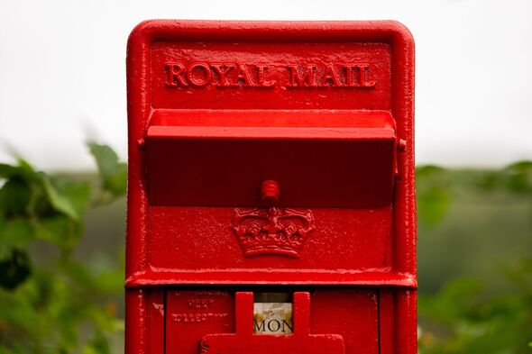 Distinctive red Royal Mail box for letters, post and mail.