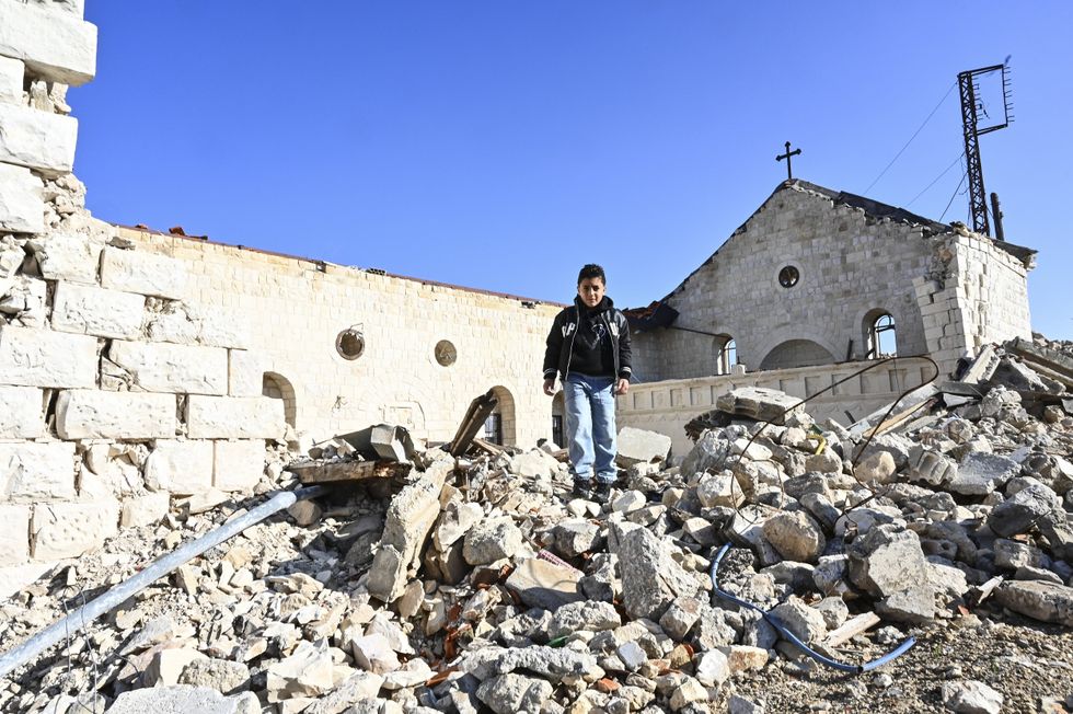 Boy in rubble of Church in Lebanon