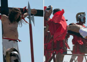 Catholic devotee marks Good Friday by being nailed to a cross during brutal crucifixion re-enactment