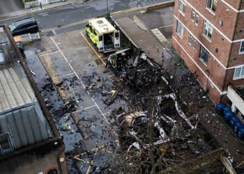 Two men and a teen boy charged over ambulance arson attack