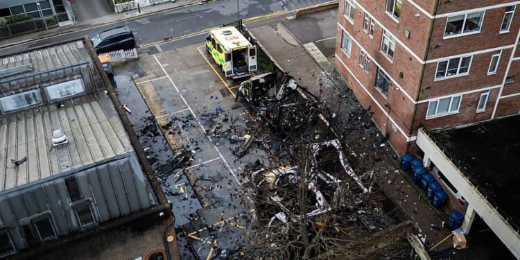 Two men and a teen boy charged over ambulance arson attack