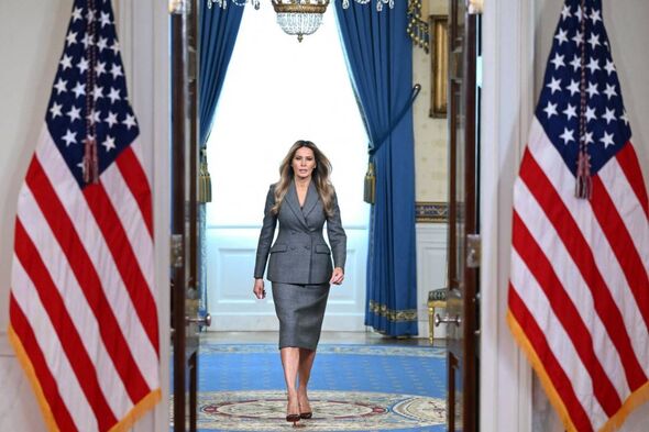 US First Lady Melania Trump walks from the Blue Room as she arrives to speak in the Cross Hall of the White House in Washington, US First Lady Melania Trump walks from the Blue Room as she arrives to speak in the Cross Hall of the White House in Washington,
