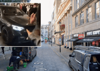 Three people injured after car ploughs into crowds as police arrest woman