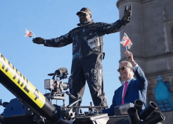 Nigel Farage and Derek Chisora ride a tank across Tower Bridge