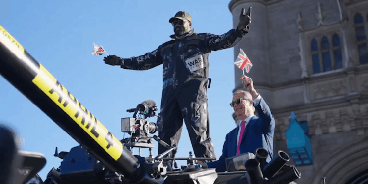 Nigel Farage and Derek Chisora ride a tank across Tower Bridge