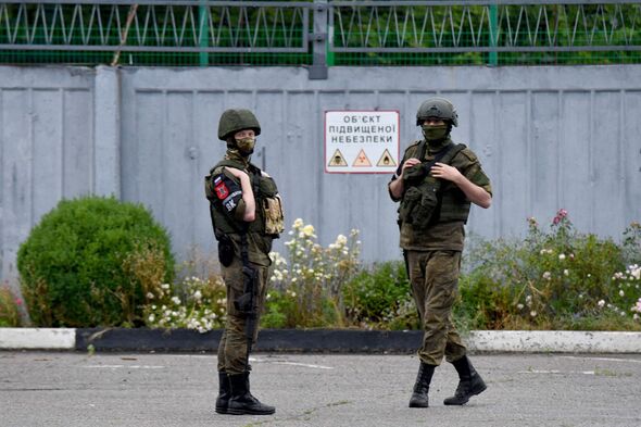 Two Russian soldiers outside the Zaporizhzhia nuclear power plant in 2023