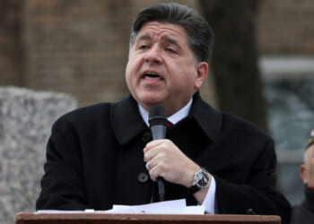 Illinois Gov. JB Pritzker delivers a short speech during a Veterans Day ceremony at Little Village's Manuel Perez Jr. Memorial Plaza on November 11, 2025 in Chicago, Illinois. After being criticized for a photo-op with other federal immigration agents in downtown Chicago on November 10th, Gregory Bonino, the top Border Patrol official leading the charge on the Trump administration's immigration crackdown in Chicago, invited the governor to Little Village. (Photo by Abel Uribe/Getty Images)